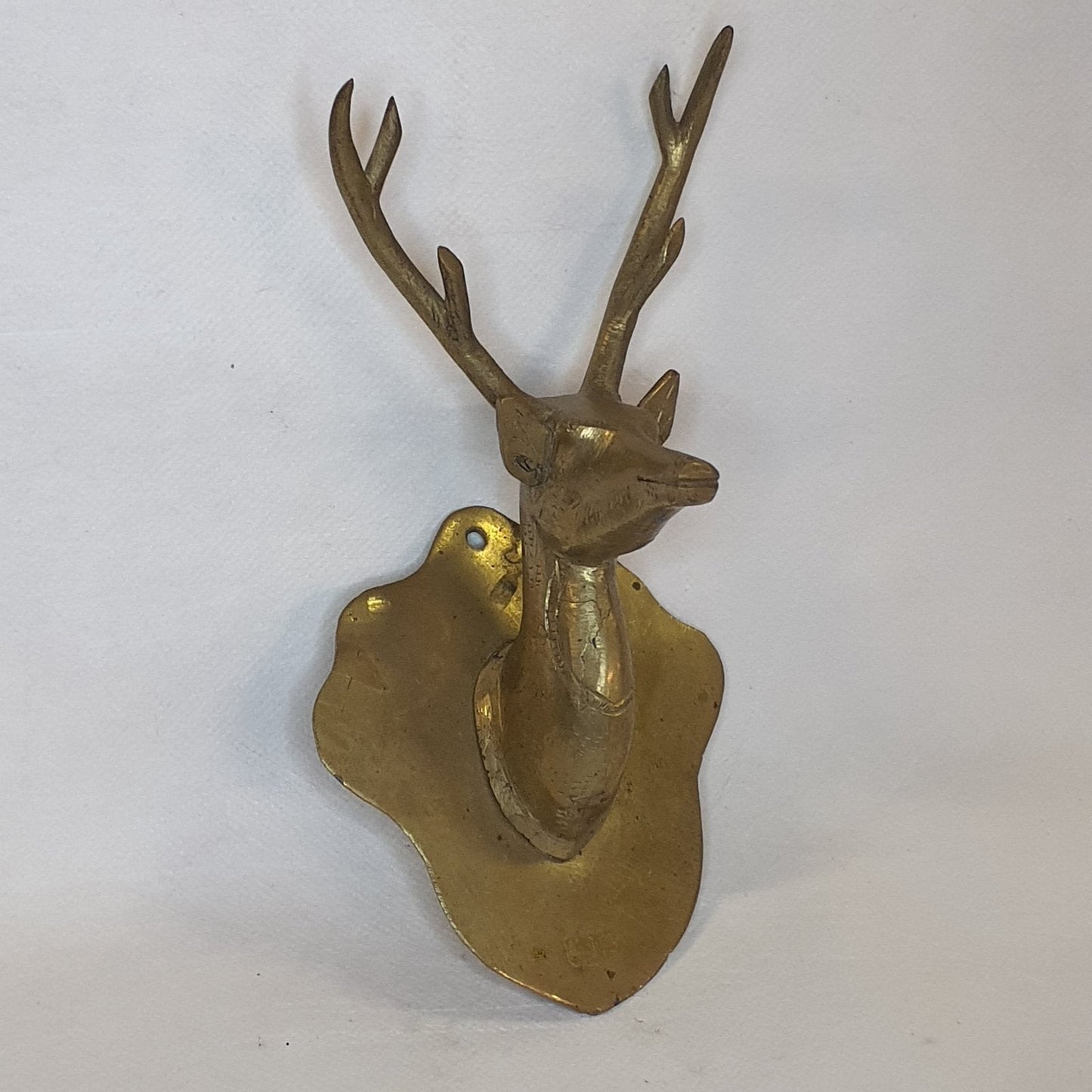 Stag head coat hook made of brass: Hand-forged and patinated using the traditional casting method