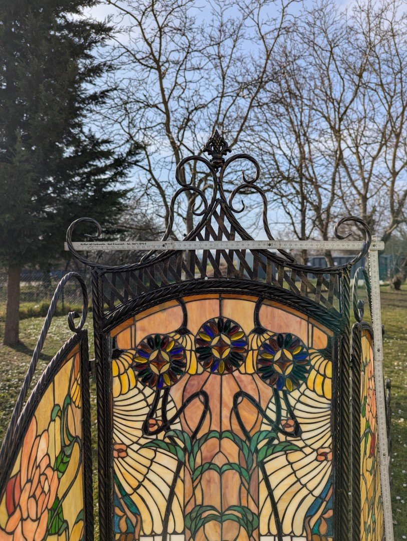 Tiffany room divider: Exclusive interplay of light with a wrought iron metal frame