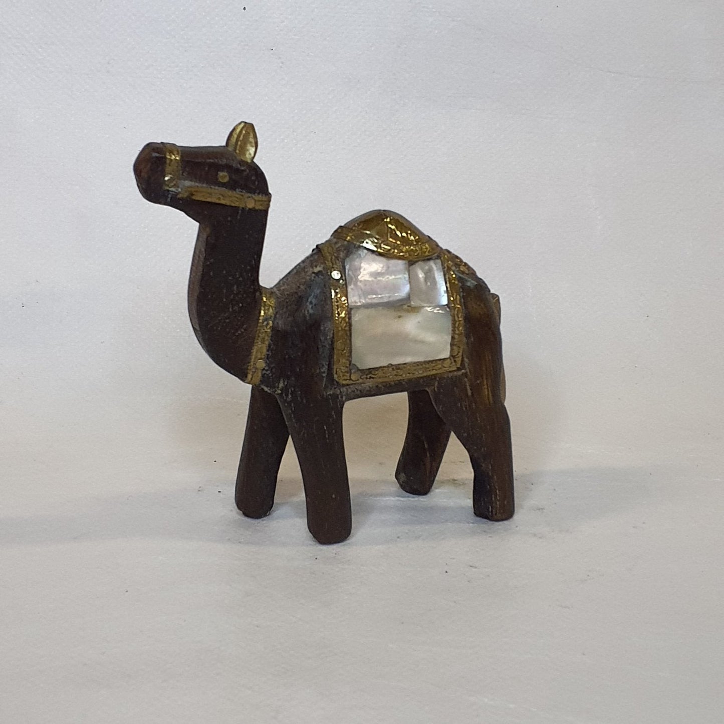 Hand-carved wooden camel: Embellished with brass, copper and shimmering mother-of-pearl.