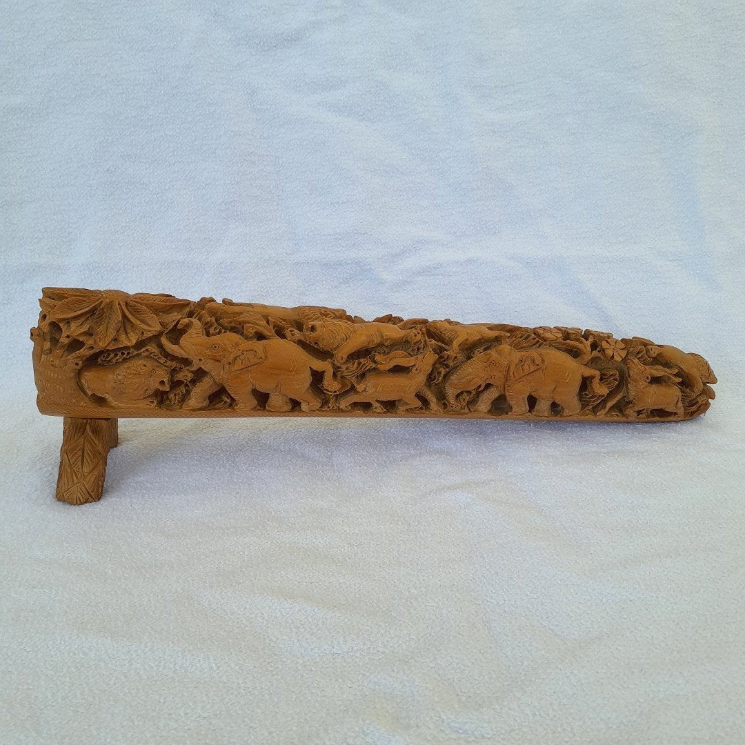 Elephant and lion hunt: Elaborately carved scene made of fine sandalwood