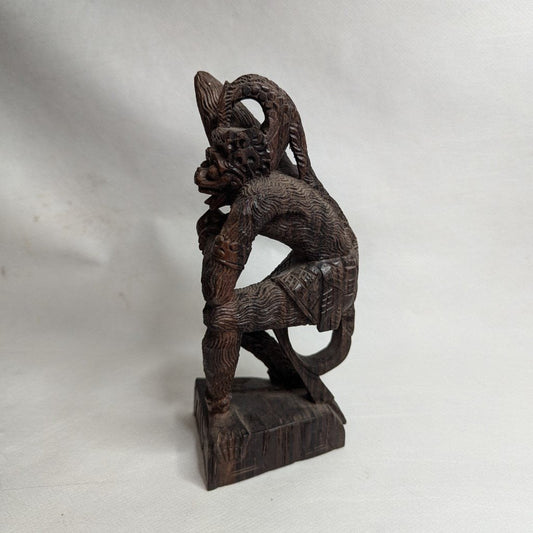 Hanuman in battle: Ancient coromandel wood statue against the Naga serpent