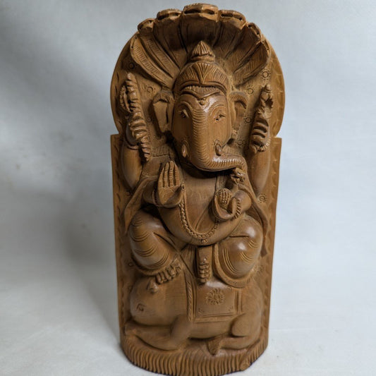 Ganesha relief made of sandalwood: Hand-carved artwork for wisdom and success