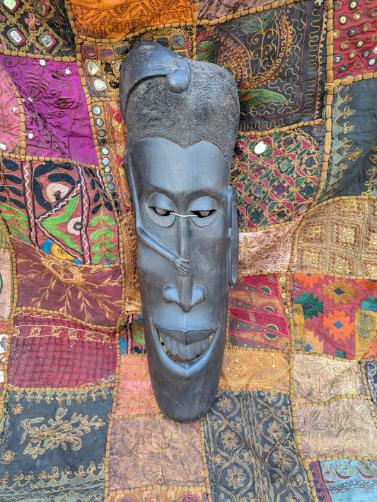African ebony mask: Hand-carved unique piece with cultural depth