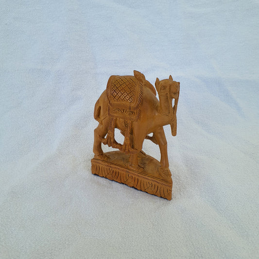 Sandalwood camel: Intricately carved collector's item with artistic ornaments
