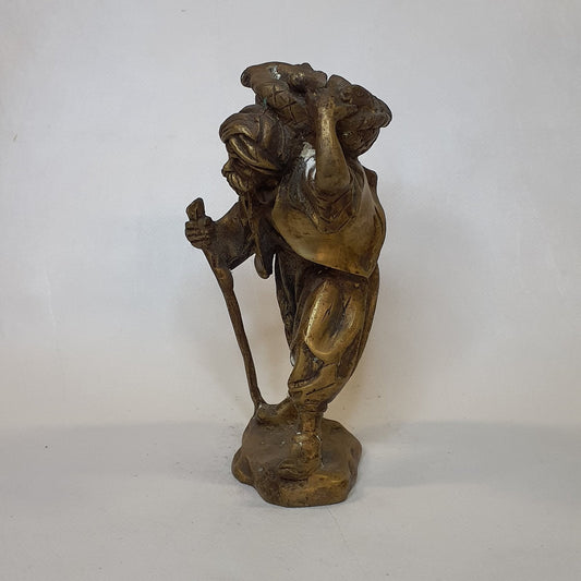 Merchant figure made of brass: Hand-forged and patinated using the traditional casting method