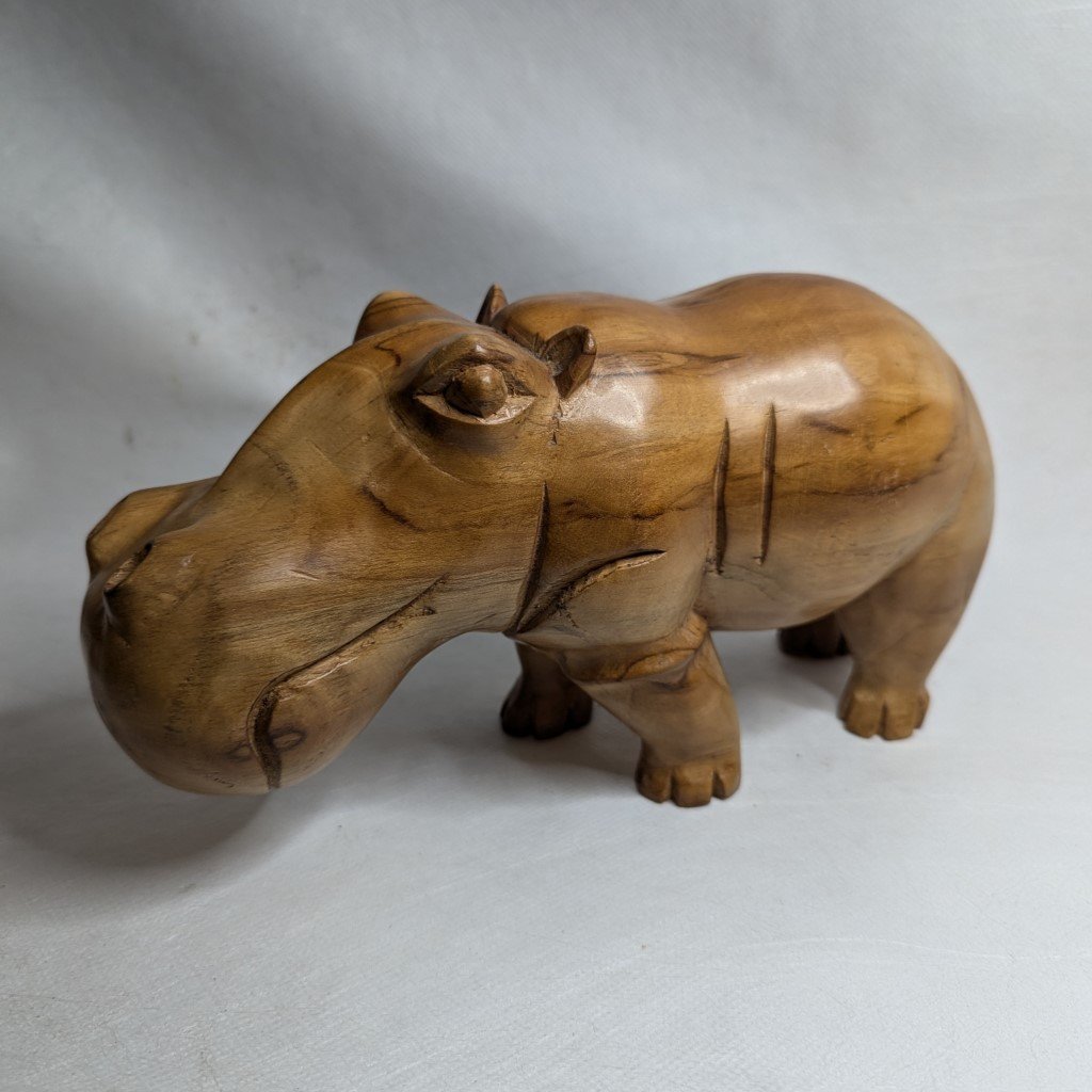 Hand-carved Iroko hippopotamus: sculpture made of solid African teak wood