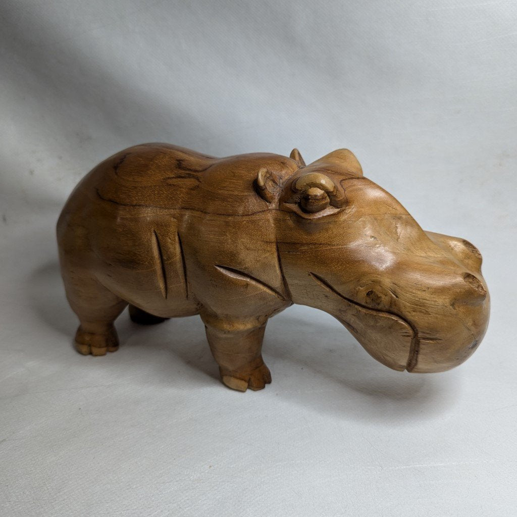 Hand-carved Iroko hippopotamus: sculpture made of solid African teak wood
