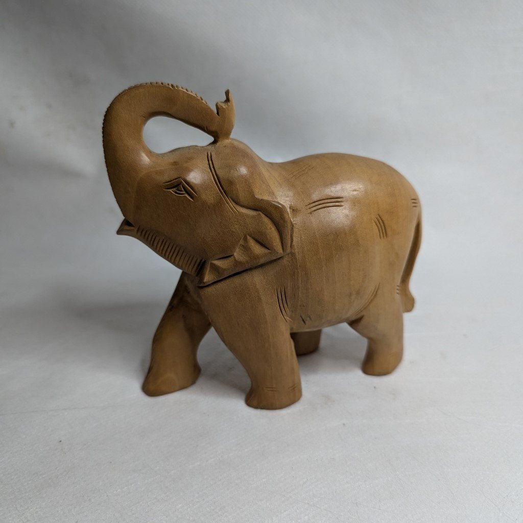 Elephant statue made of linden wood: Hand-carved symbol of luck and strength