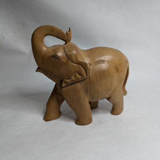 Elephant statue made of linden wood: Hand-carved symbol of luck and strength