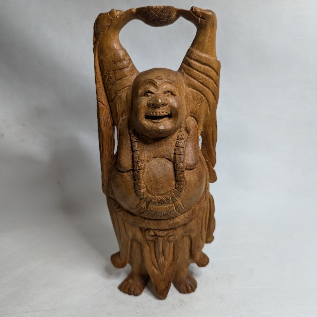 Buddha relief made of sandalwood: Hand-carved decorative element for spiritual tranquility