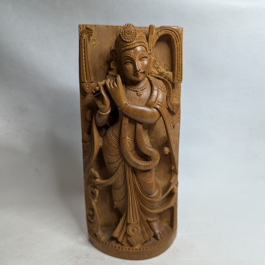 Krishna relief in sandalwood: Hand-carved artwork for spiritual depth