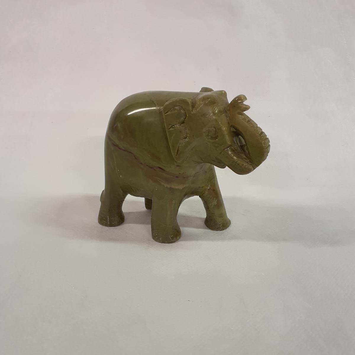 Elephant statue made of soapstone: Hand-carved symbol of luck and strength