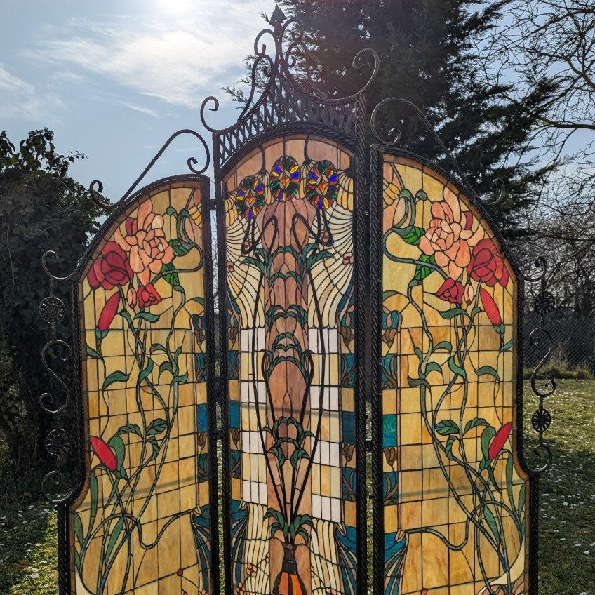 Tiffany room divider: Exclusive interplay of light with a wrought iron metal frame