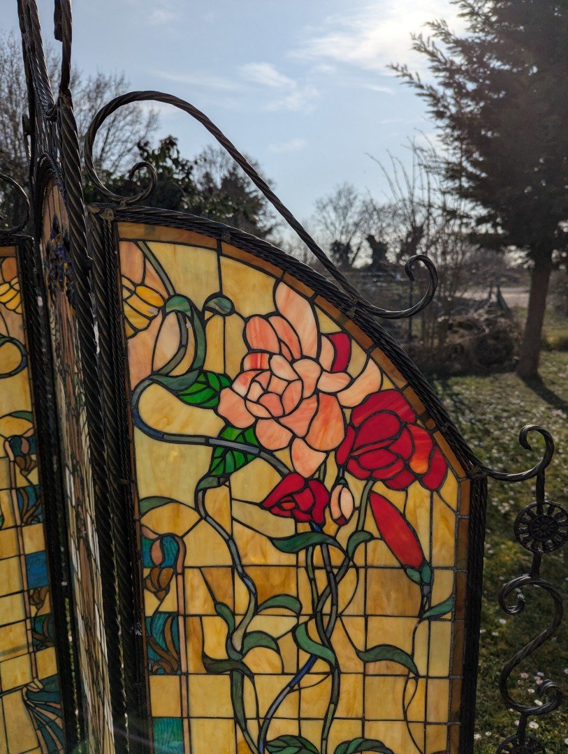 Tiffany room divider: Exclusive interplay of light with a wrought iron metal frame