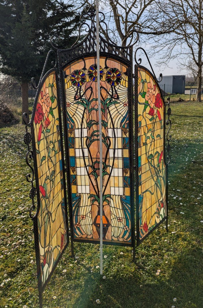 Tiffany room divider: Exclusive interplay of light with a wrought iron metal frame