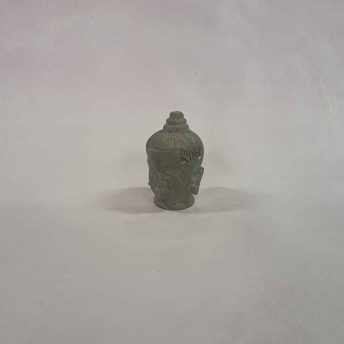 Buddha head made of soapstone: Hand-carved symbol of peace and spirituality