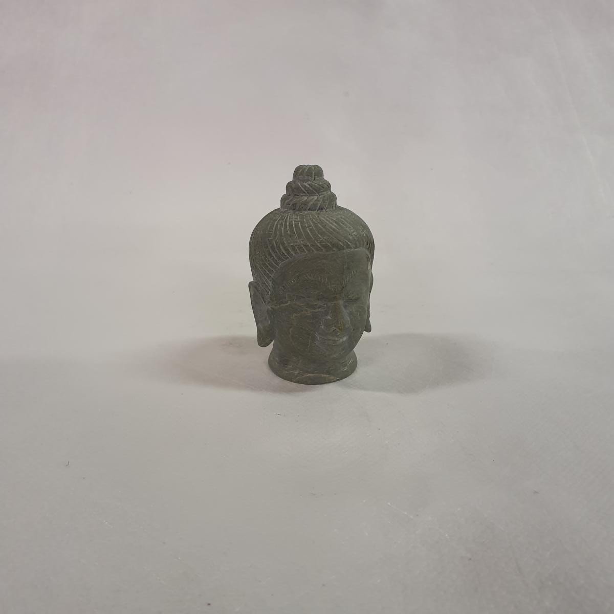 Buddha head made of soapstone: Hand-carved symbol of peace and spirituality