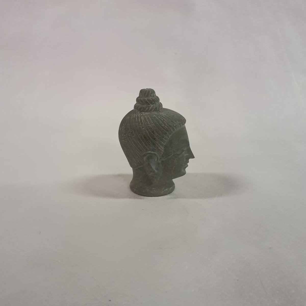 Buddha head made of soapstone: Hand-carved symbol of peace and spirituality