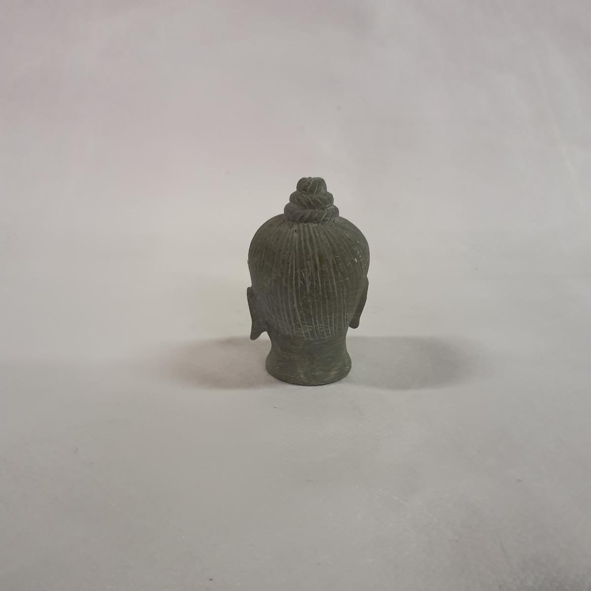 Buddha head made of soapstone: Hand-carved symbol of peace and spirituality