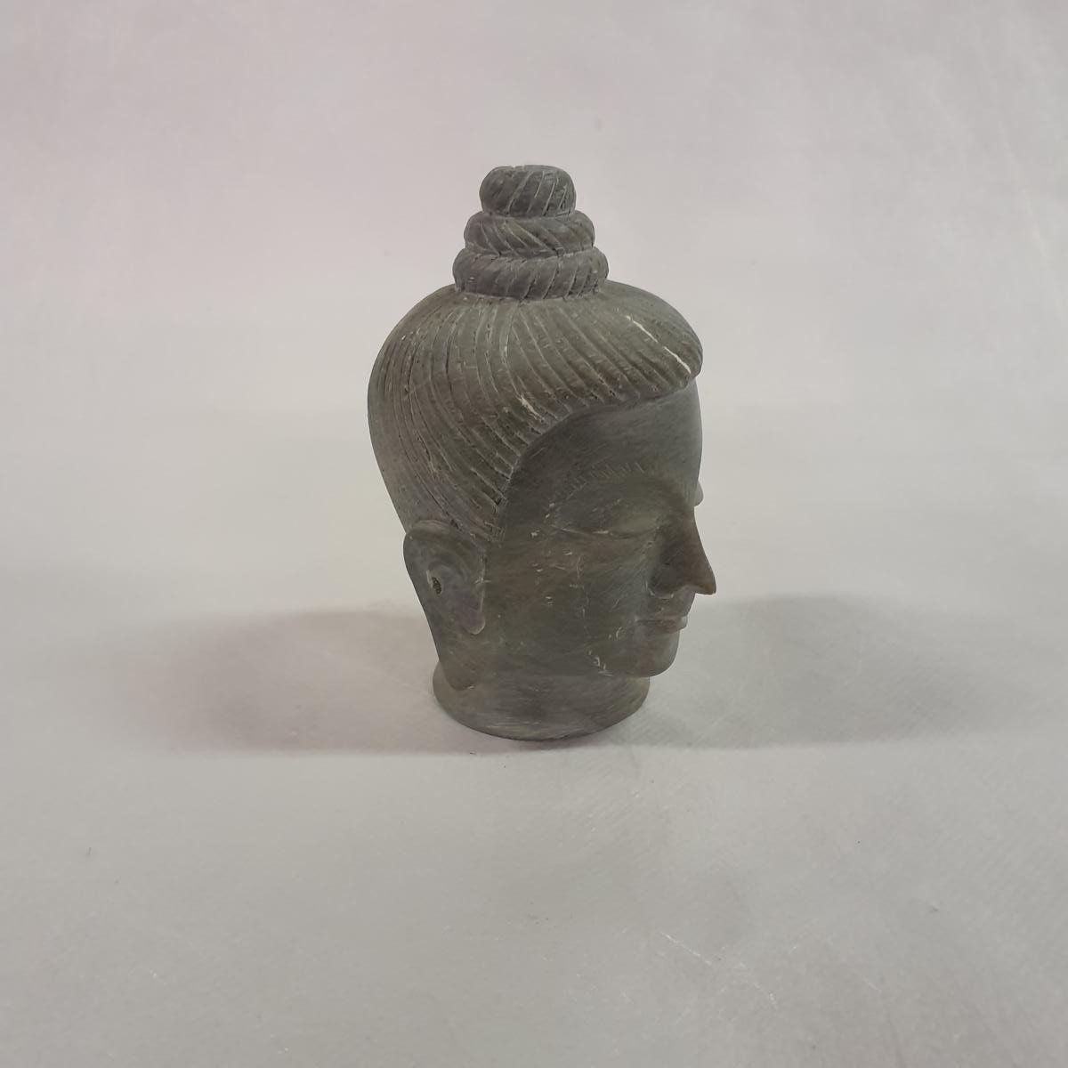 Buddha head carved from soapstone: Hand-carved symbol of inner peace