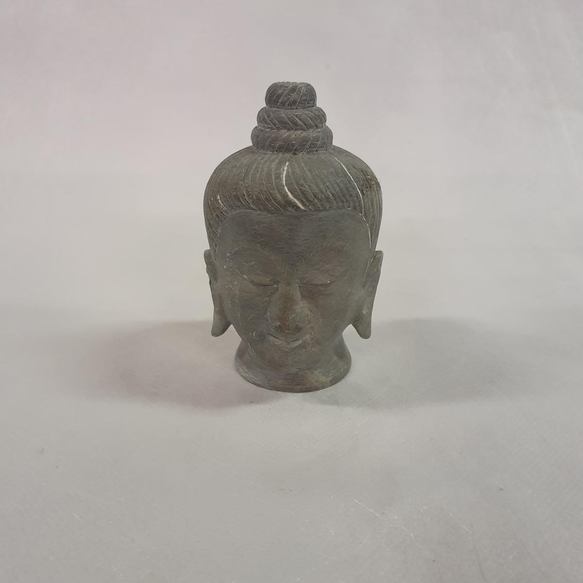 Buddha head carved from soapstone: Hand-carved symbol of inner peace