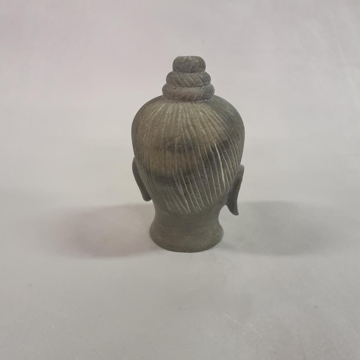 Buddha head carved from soapstone: Hand-carved symbol of inner peace