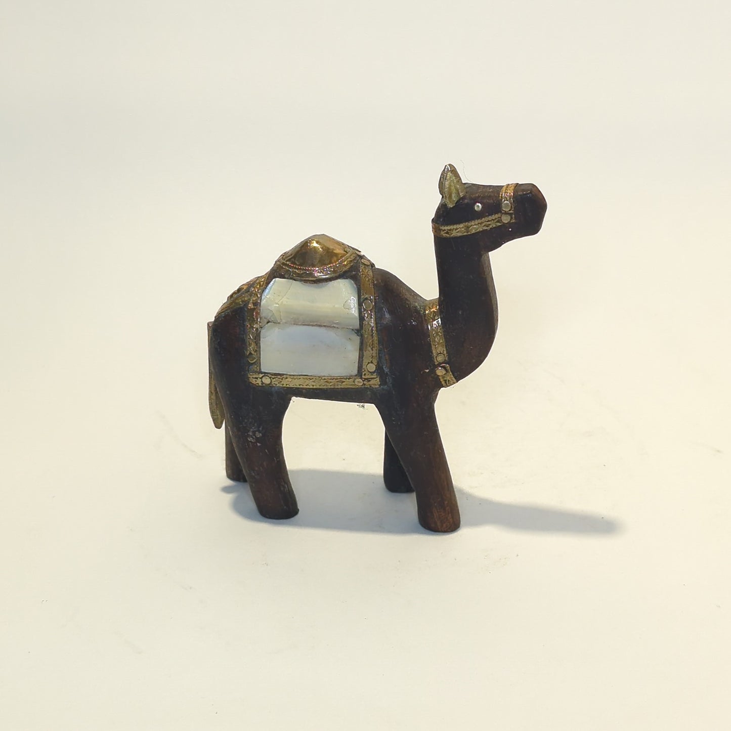 Hand-carved wooden camel: Embellished with brass, copper and shimmering mother-of-pearl.