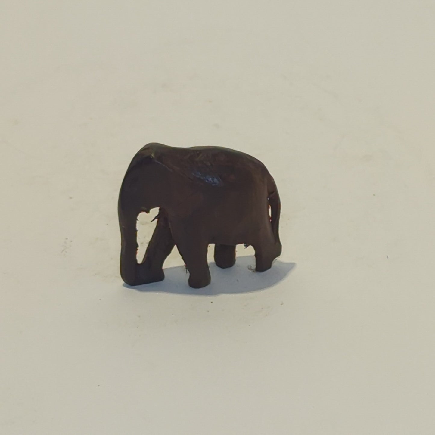 Hand-carved rosewood elephant: An exquisite miniature with symbolic power