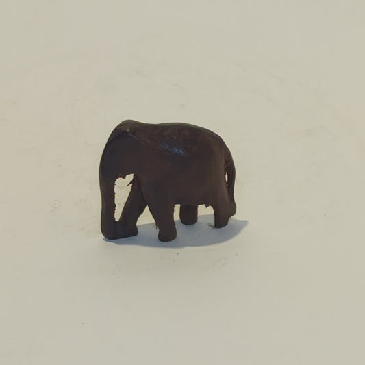 Hand-carved rosewood elephant: An exquisite miniature with symbolic power