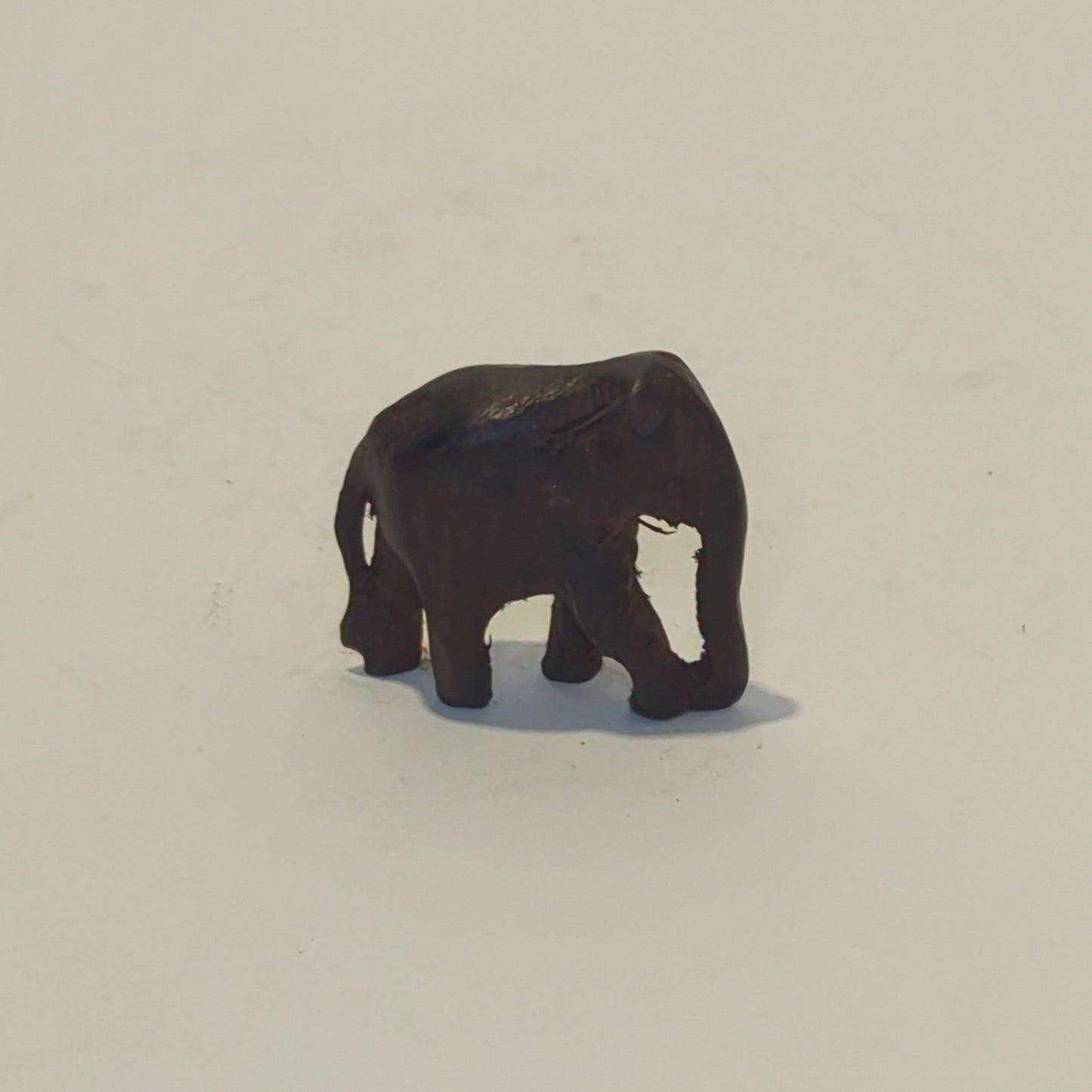 Hand-carved rosewood elephant: An exquisite miniature with symbolic power