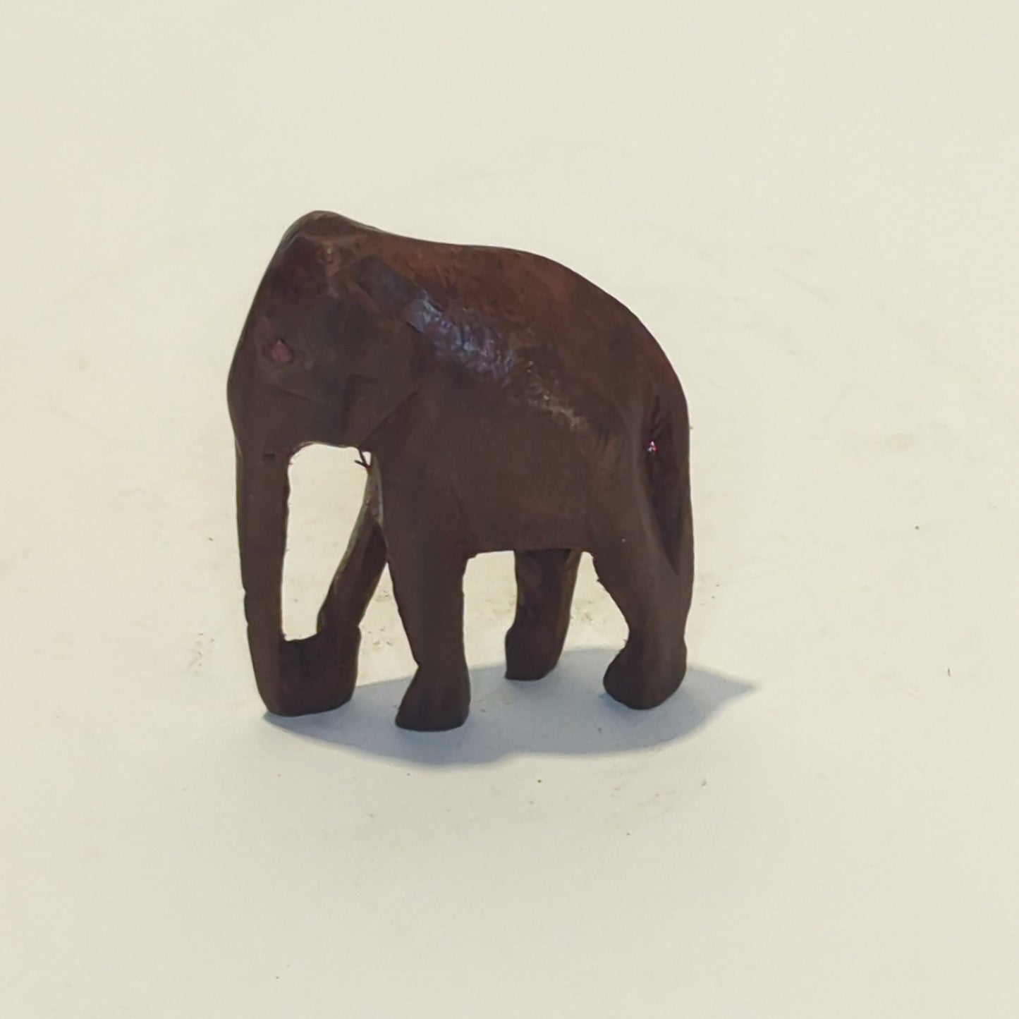 Hand-carved rosewood elephant: An exquisite miniature with symbolic power