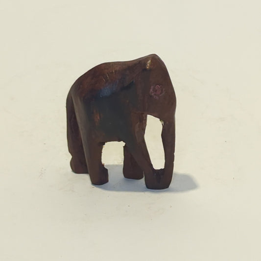 Hand-carved rosewood elephant: An exquisite miniature with symbolic power