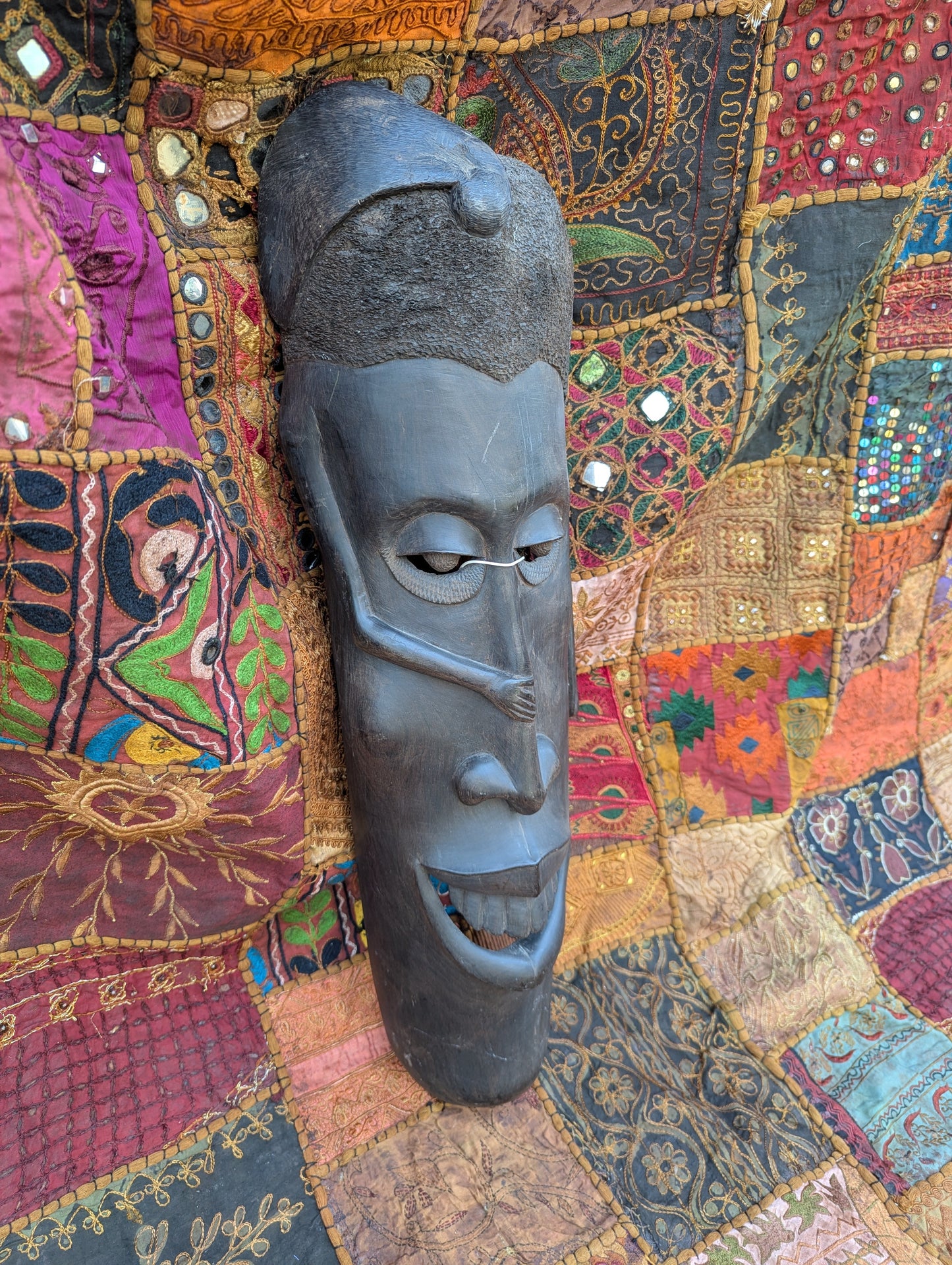 African ebony mask: Hand-carved unique piece with cultural depth