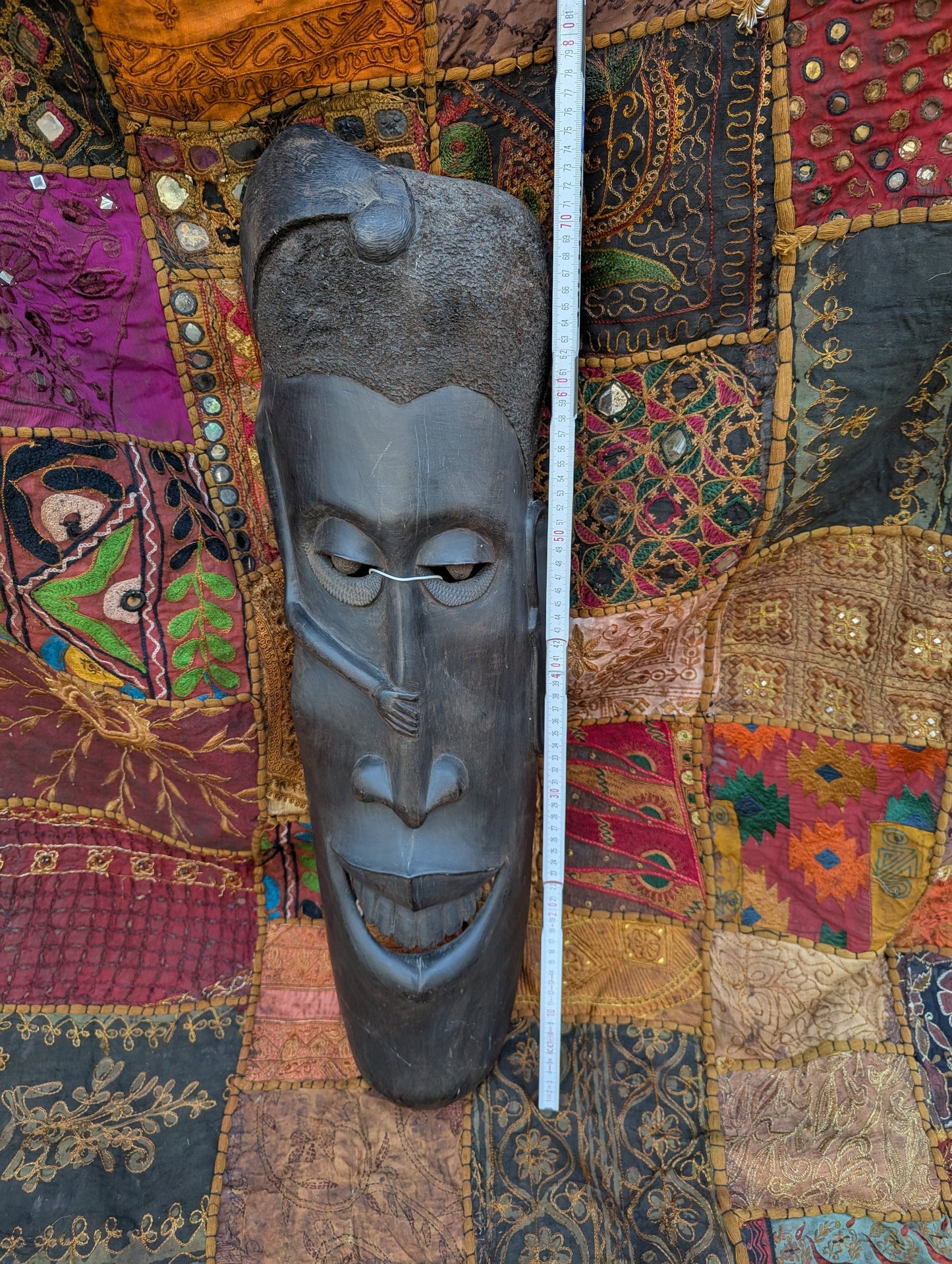 African ebony mask: Hand-carved unique piece with cultural depth