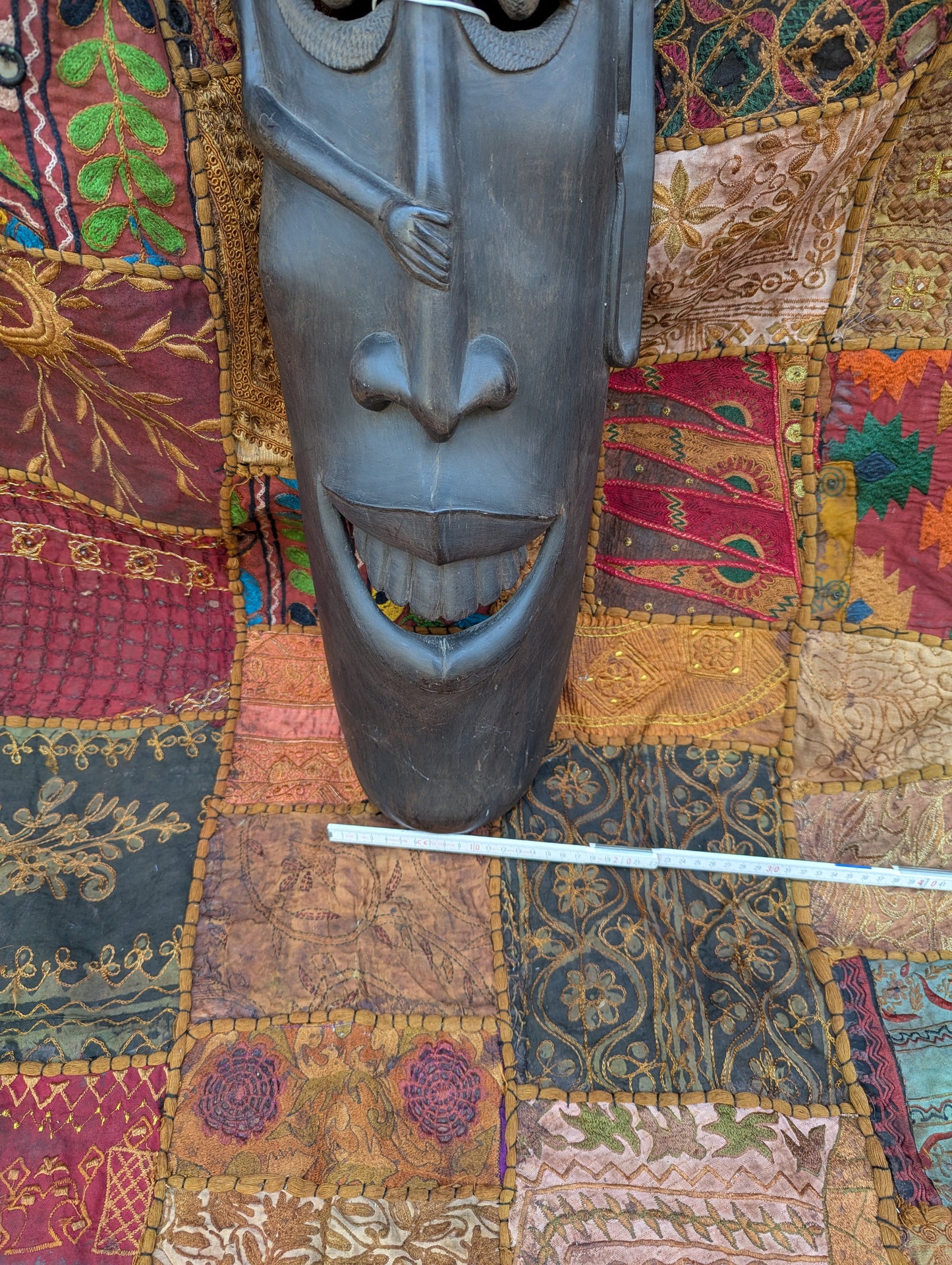 African ebony mask: Hand-carved unique piece with cultural depth